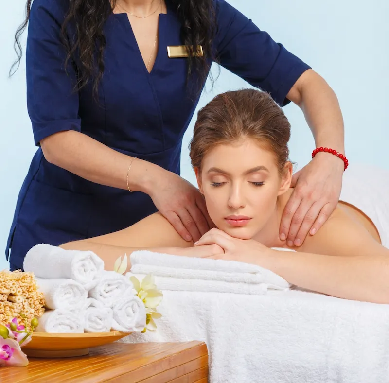 Relaxing spa environment with towels and flowers